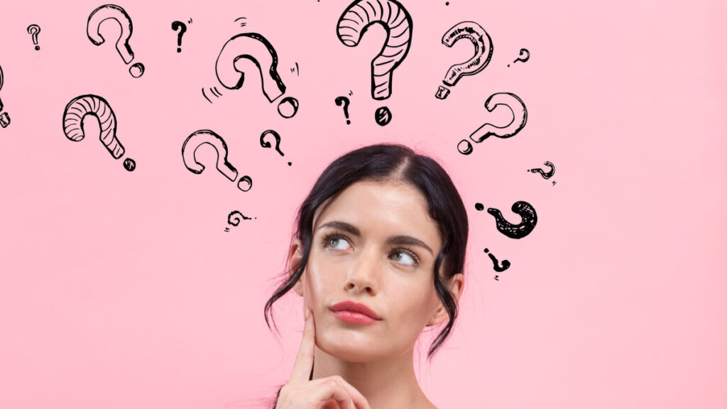 クエスチョンマークと女性